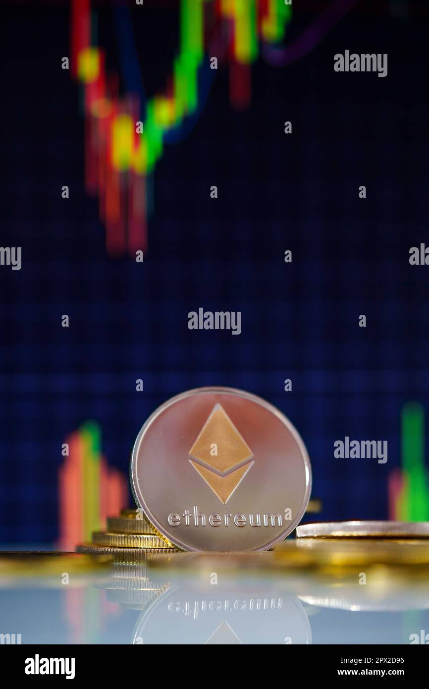 Stack or heap of gold Ethereum cryptocurrency with candle stick graph