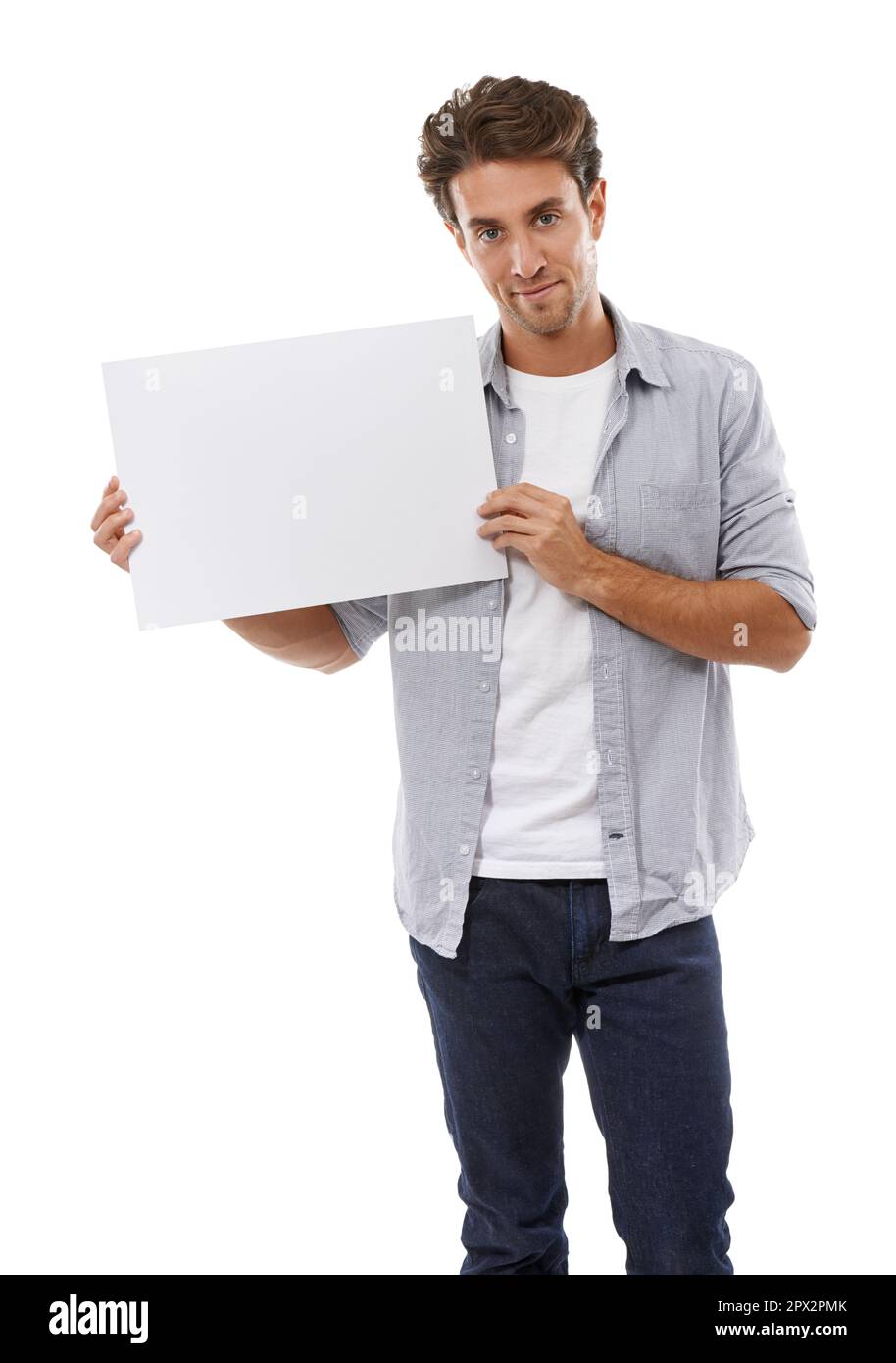 Ive got your copyspace right here. Portrait of a handsome young man holding a sign for your copyspace. Stock Photo