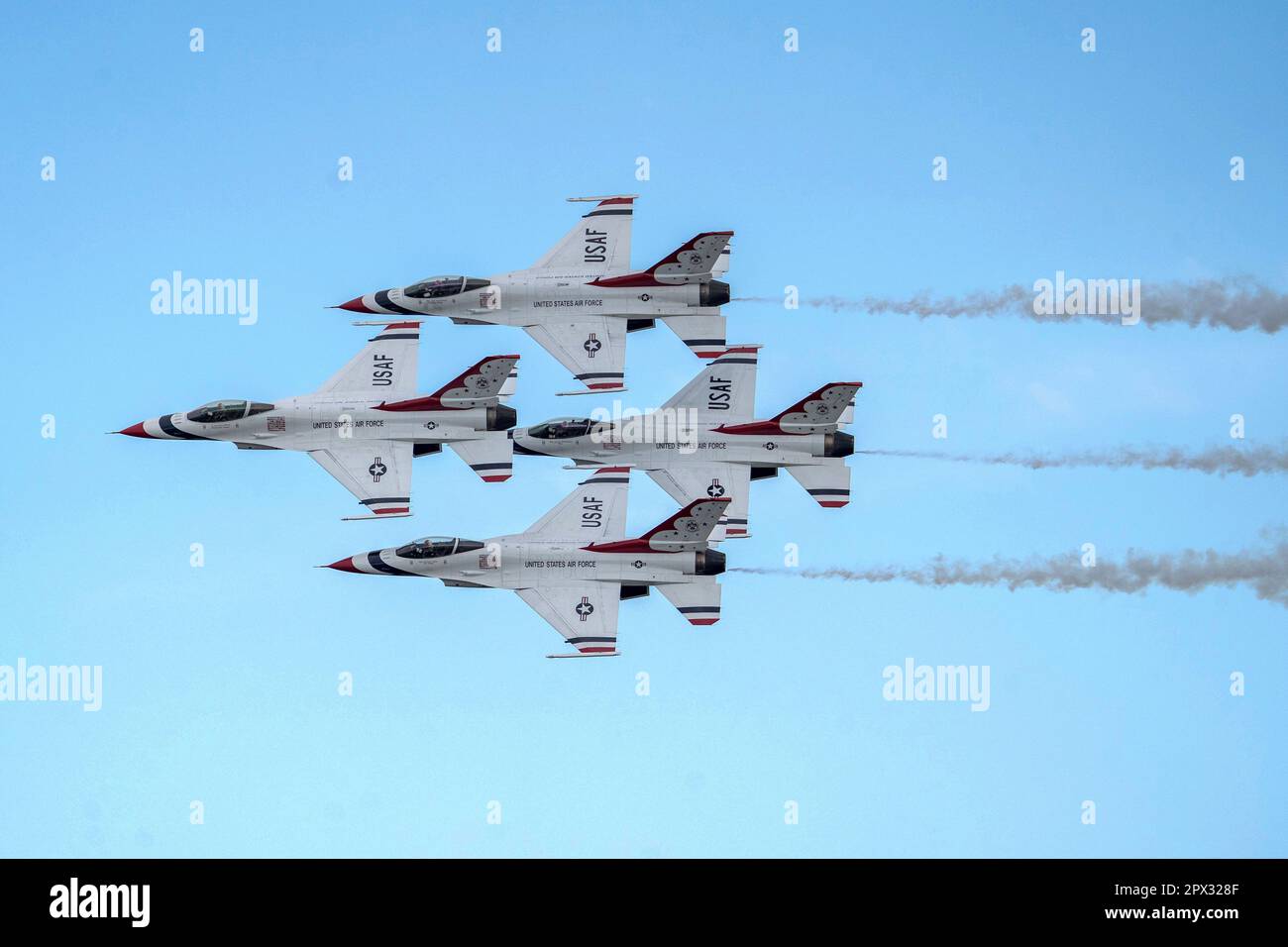 Four Thunderbirds fly in a close diamond formation during Thunder Over
