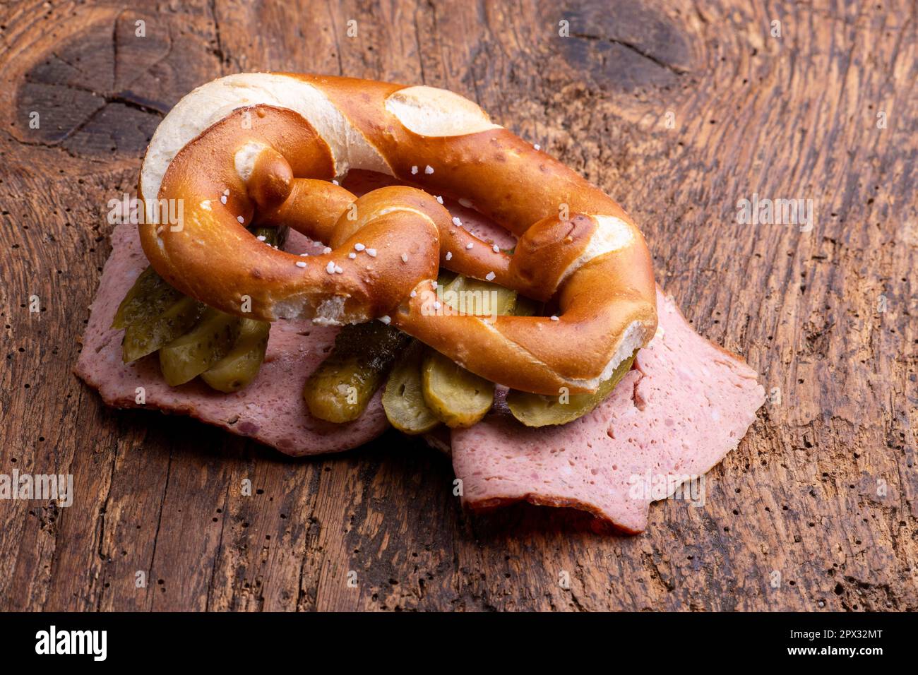 meatloaf slices in a pretzel on wood Stock Photo