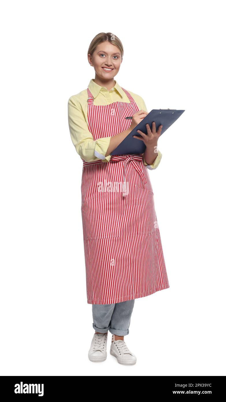 Beautiful young woman in clean striped apron with clipboard on white ...