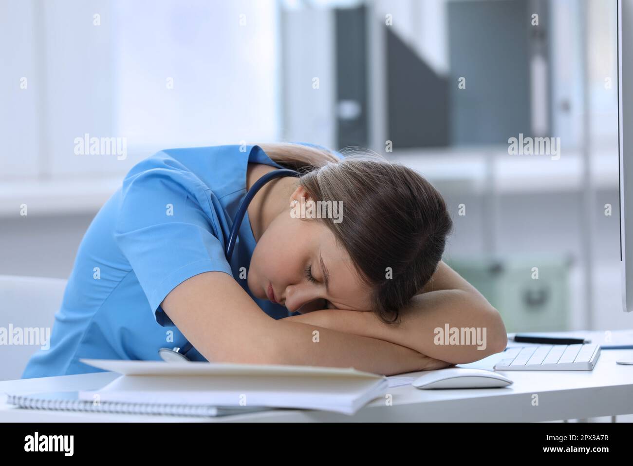 Exhausted doctor sleeping workplace hi-res stock photography and images ...