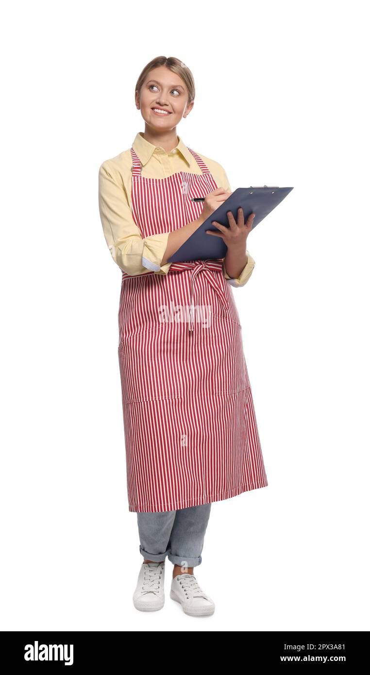 Beautiful young woman in clean striped apron with clipboard on white ...