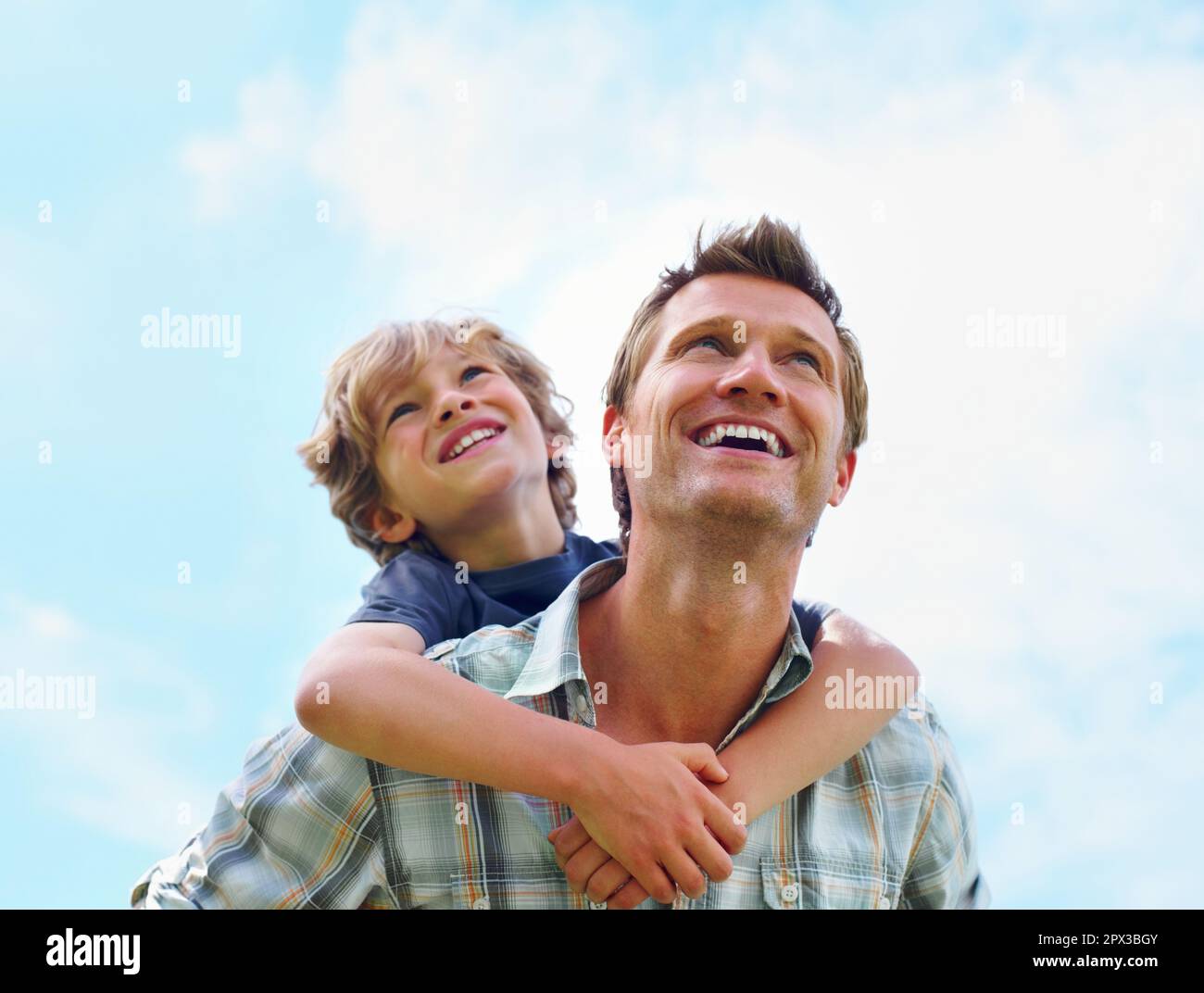 Dad giving son piggyback ride hi-res stock photography and images - Alamy