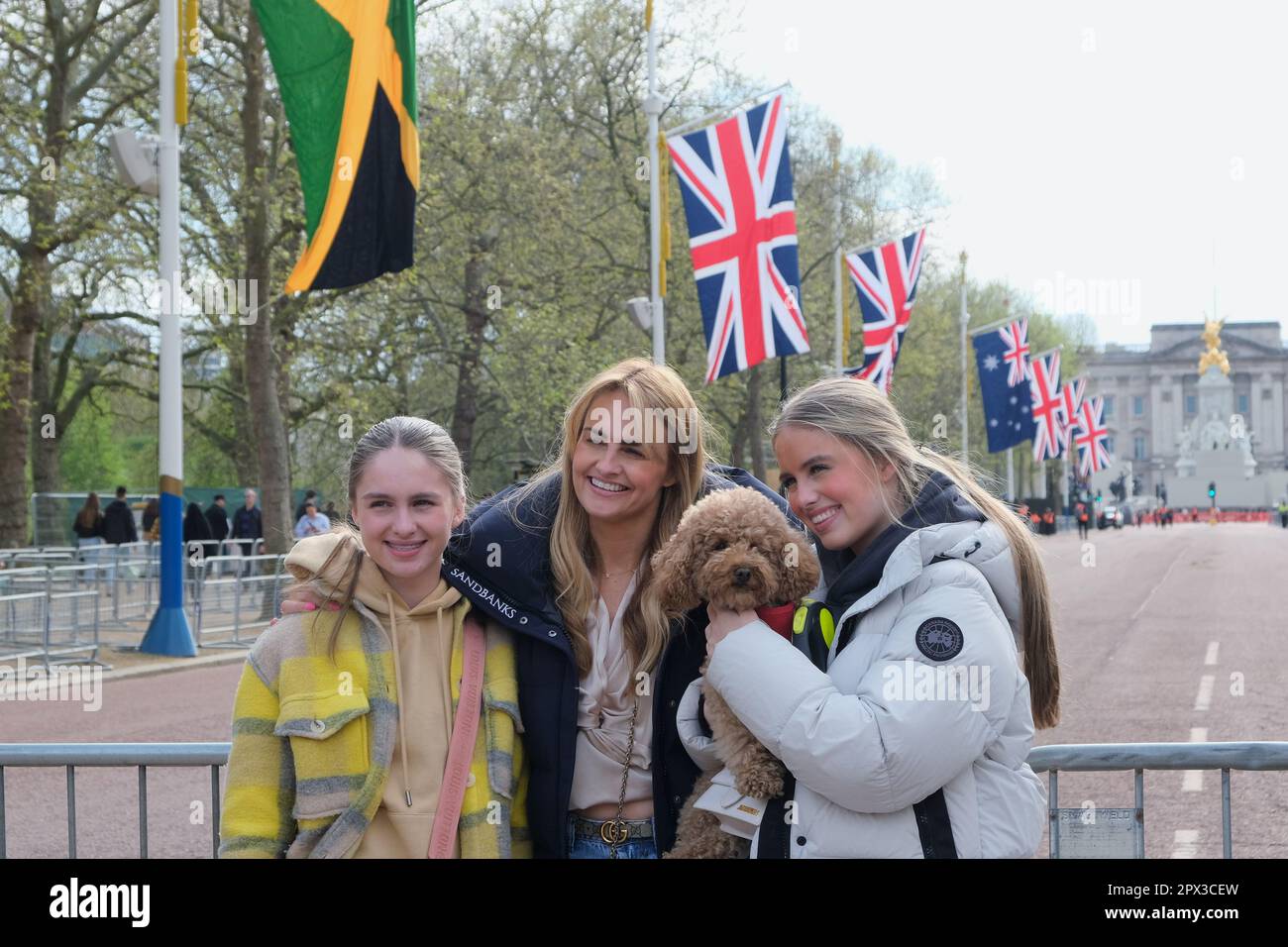 A family has their photo taken along the Mall, decorated with Union ...