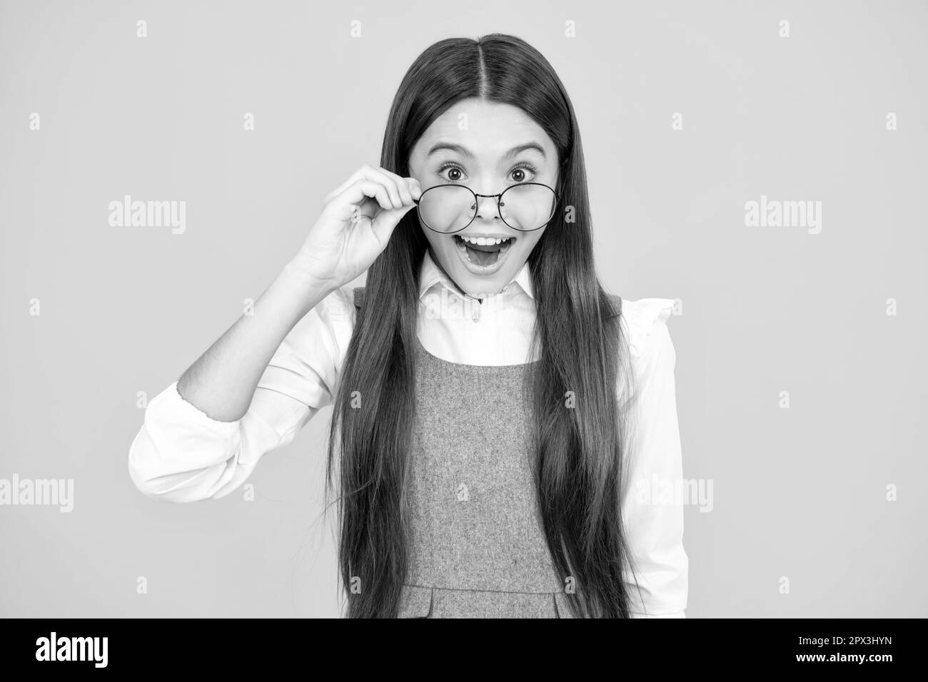 Amazed expression, cheerful and glad. Teenager child with poor eyesight