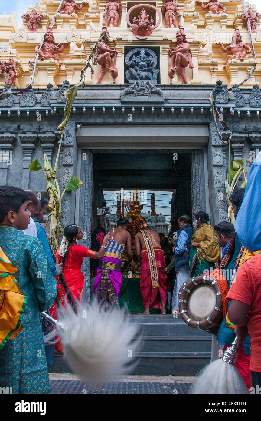 Effigy of a deity is carried out of a temple at the Tamil Hindu community's Mahotsavam Chariot Festival 2023, Melbourne, Australia Stock Photo
