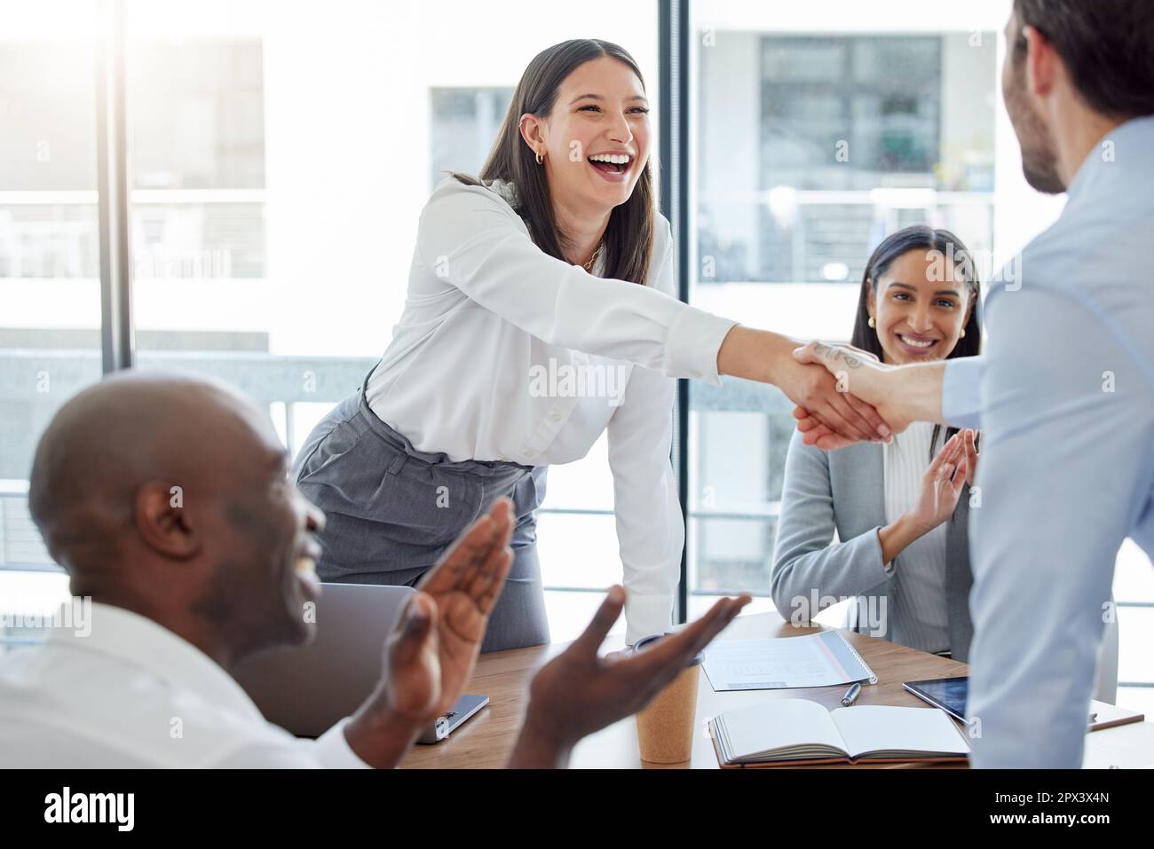 Youve done really great. two businesspeople shaking hands in an office