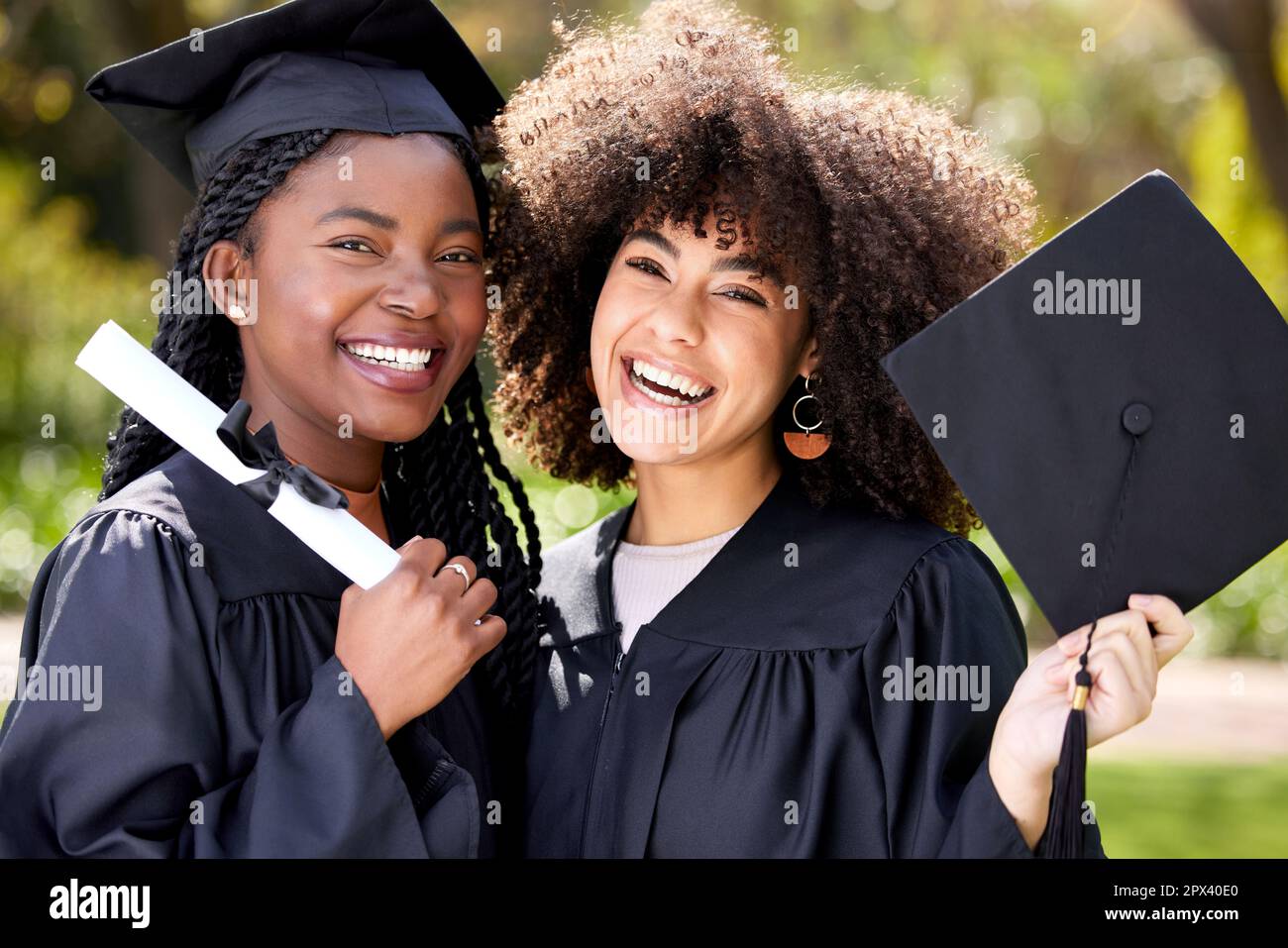 What a rad grad. Portrait of two young women celebrating their graduation  Stock Photo - Alamy