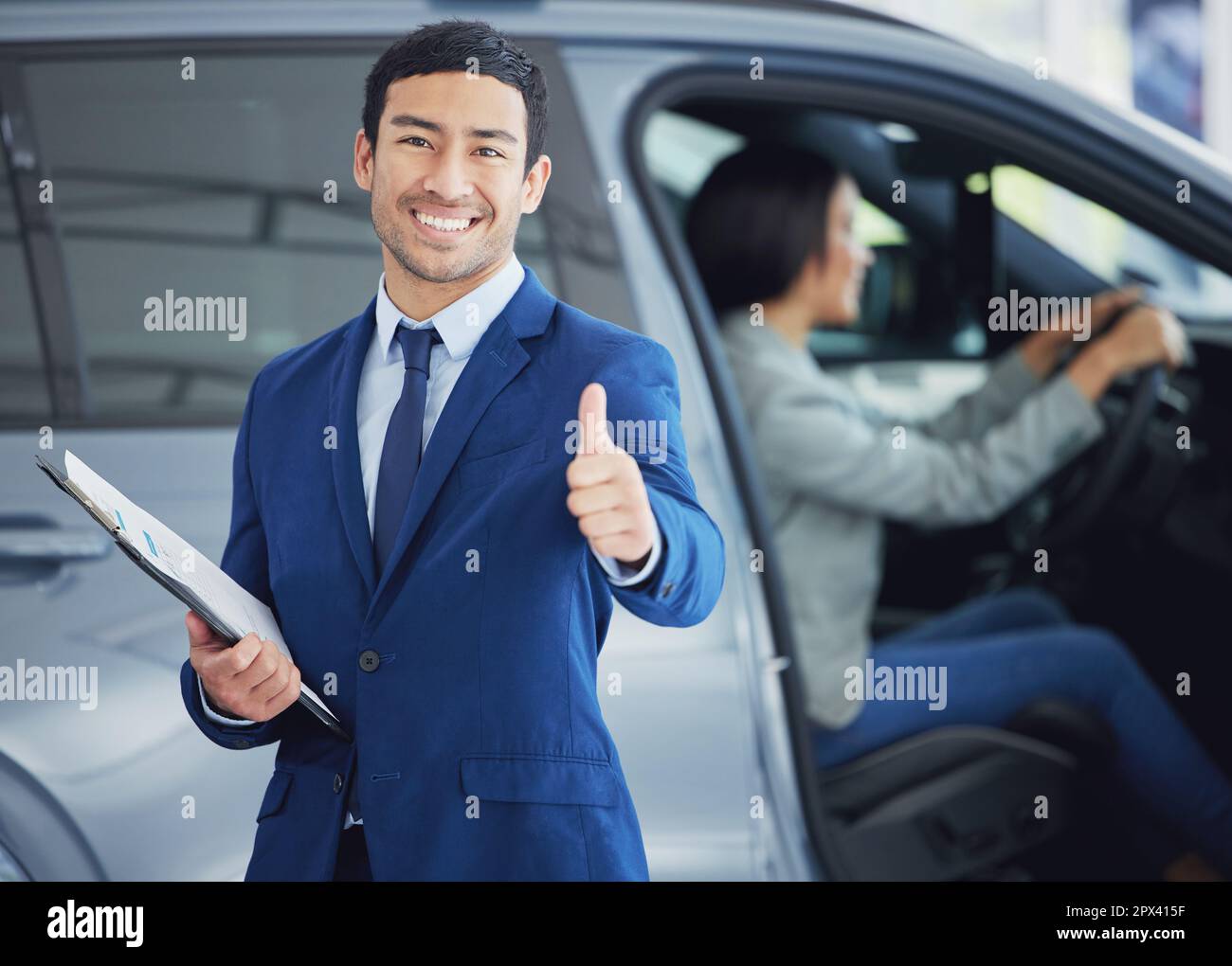 Looks like Ive made the sale. Cropped portrait of a handsome young male car salesman giving