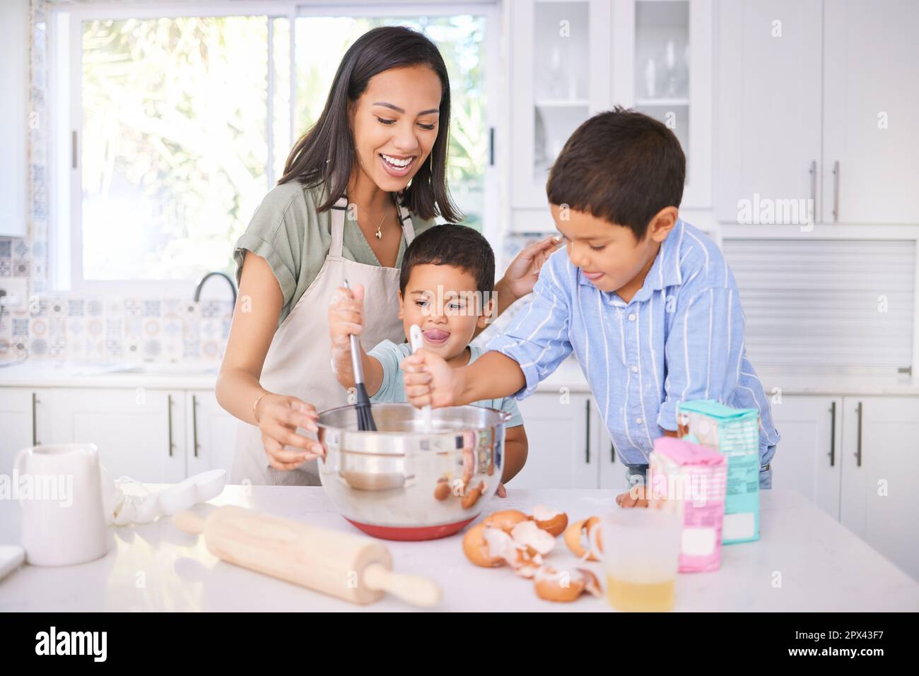 https://c8.alamy.com/comp/2PX43F7/baking-kids-and-mom-in-the-home-kitchen-cooking-food-with-a-boy-and-baby-with-happiness-family-mother-and-happy-children-smile-at-a-house-teaching-2PX43F7.jpg