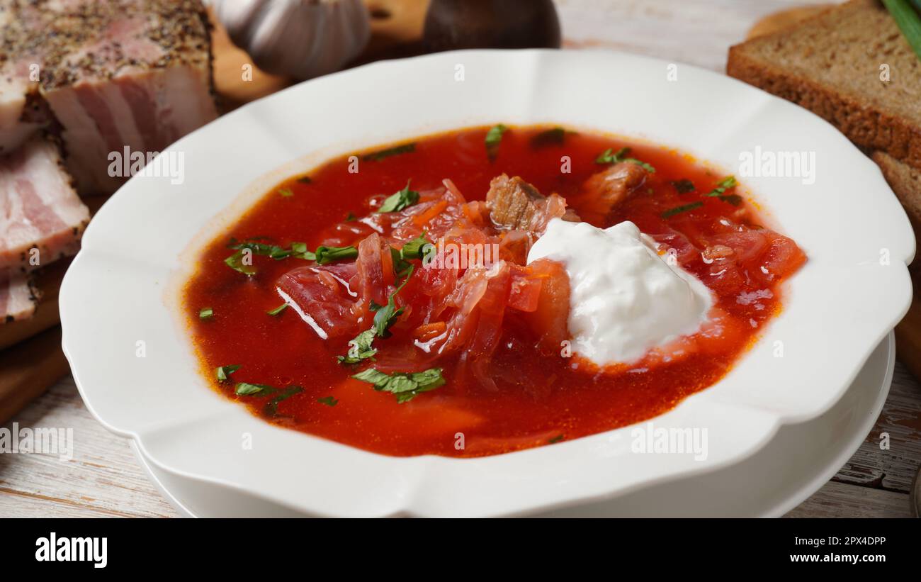 Traditional Ukrainian borscht . White plate of red beet root soup ...