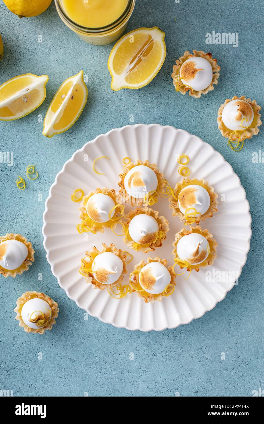 Mini lemon meringue tarts filled with lemon curd, one bite desserts