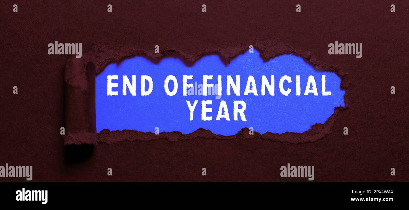 Hand writing sign End Of Financial Year, Word Written on Revise and edit accounting sheets from