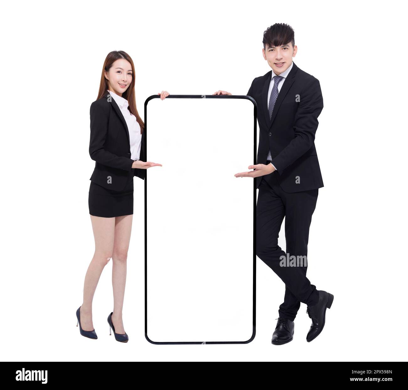 Business man and woman standing and showing smartphone with blank screen Stock Photo