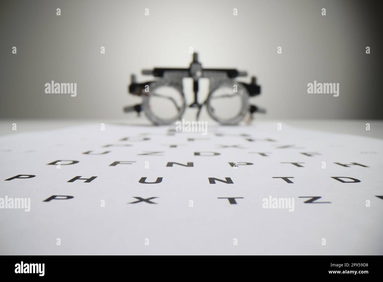Snellen chart letters against blurred ophthalmology goggles Stock Photo Alamy