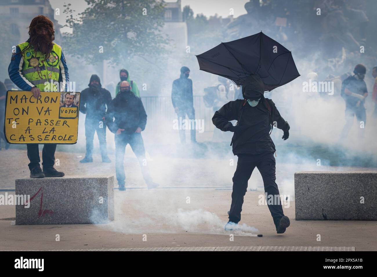 Paris France 01st May 2023 A Protester Kicks A Tear Gas Canister During The Rally Thousands 