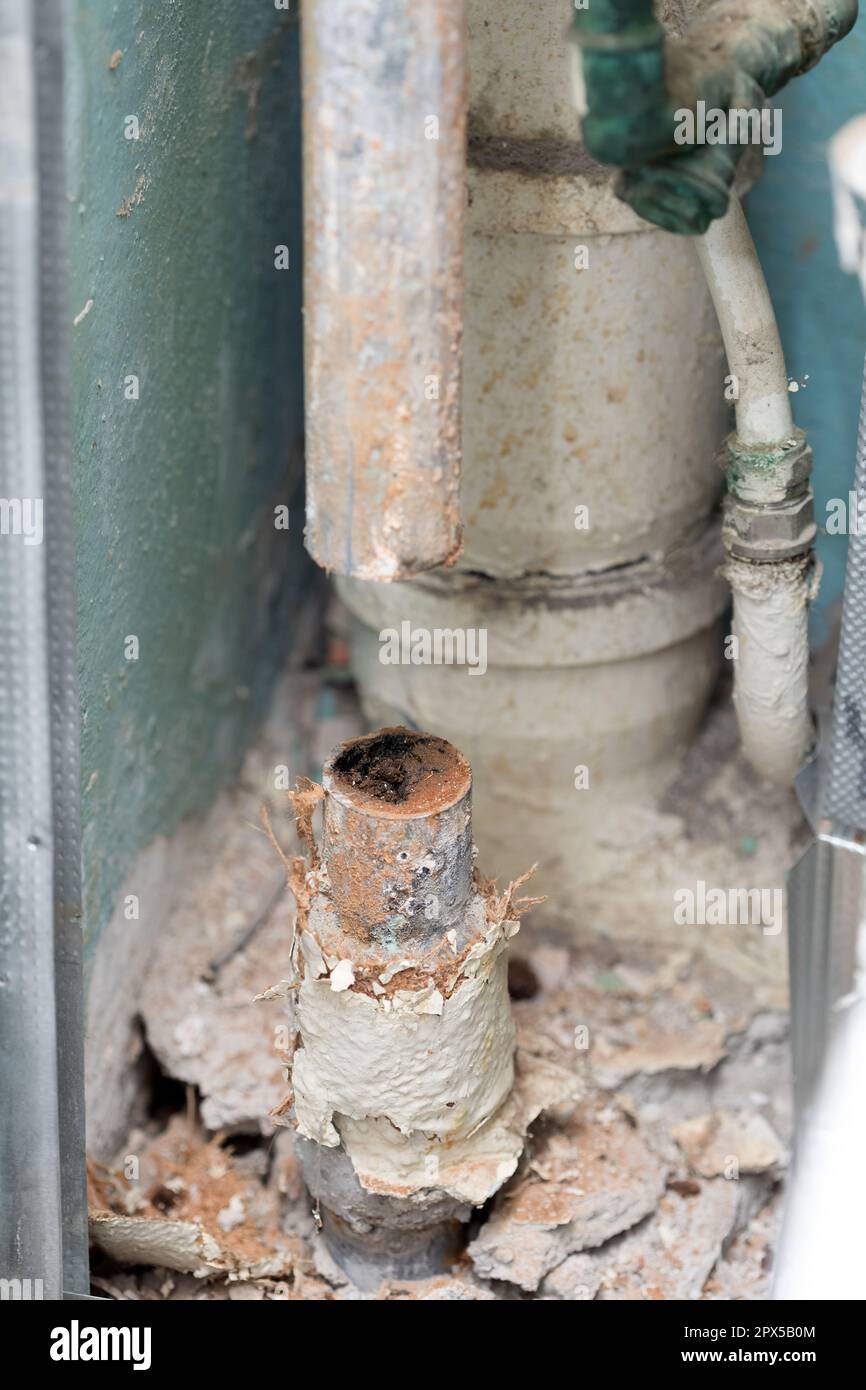 Old water pipe line clogged with rust Stock Photo