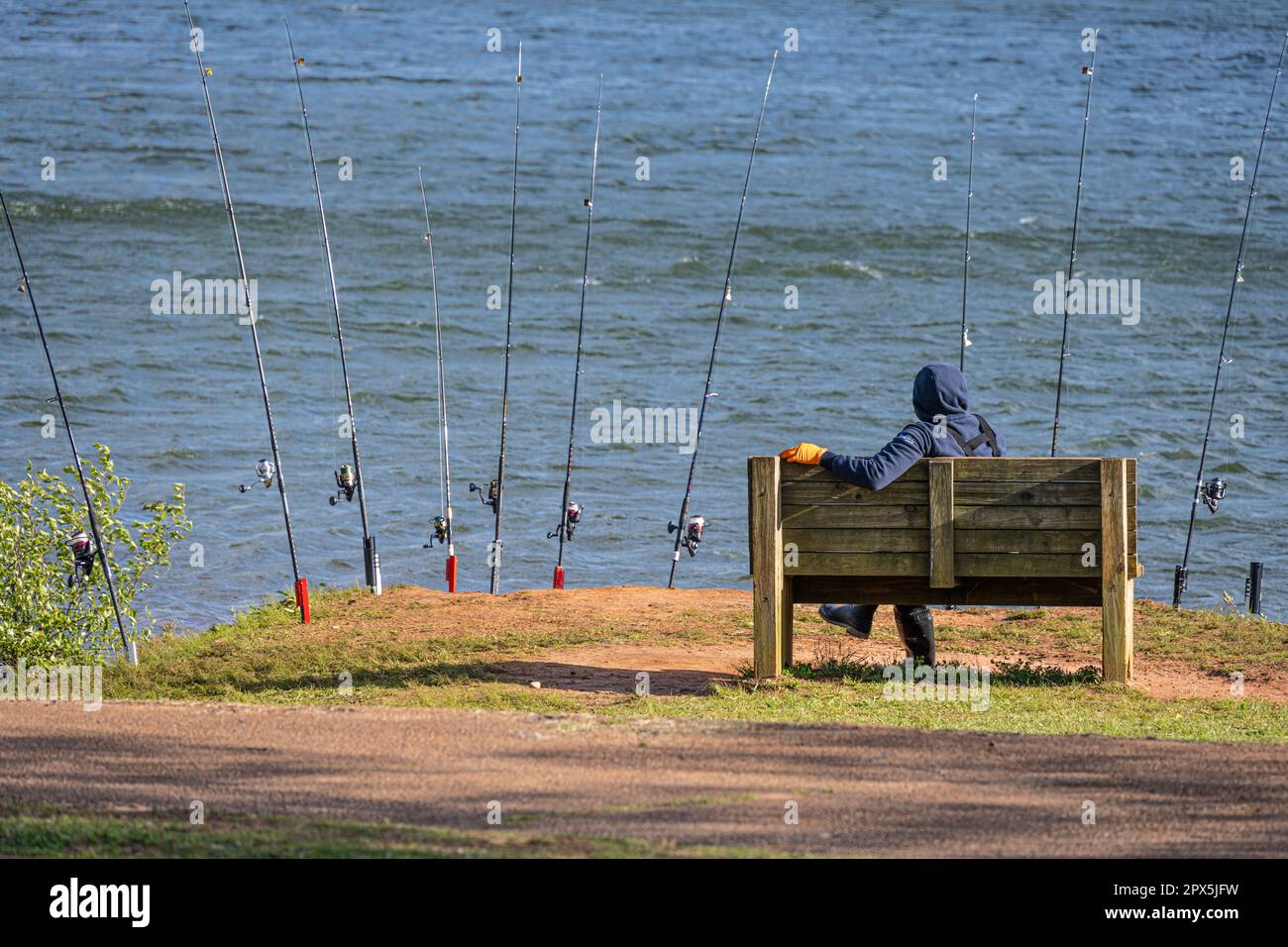 Fisherman watching his ten lines at Laurel Park on Lake Lanier in Gainesville, Georgia. (USA) Stock Photo