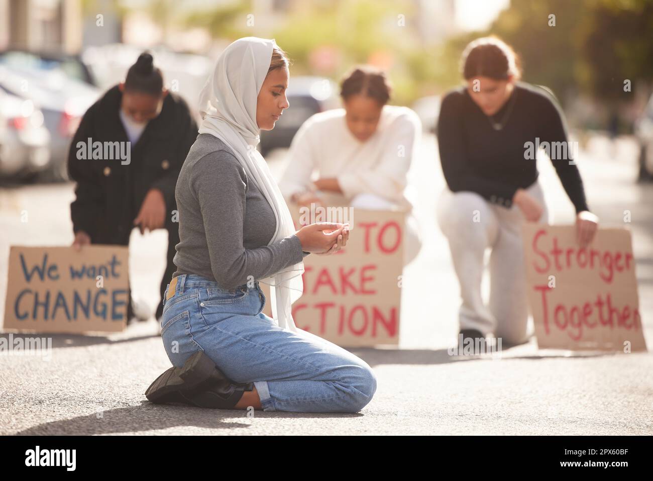 Protest, Islamic woman and pray in street, group and support for Palestine. Muslim female, girl or protesters with cardboard signs, fight for justice Stock Photo