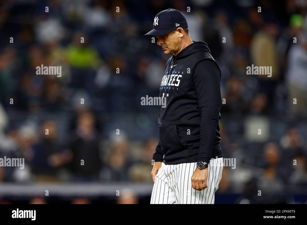 New York Yankees manager Aaron Boone (17) walks off the field after making  a pitching change in the ninth inning against the Cleveland Guardians in a  baseball game, Monday, May 1, 2023