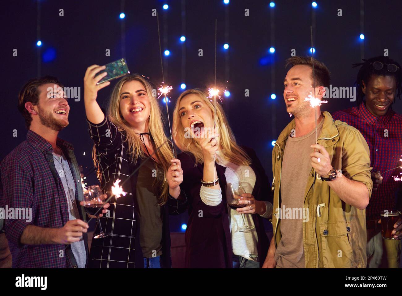 We love taking selfies when its party time. a group of friends taking a