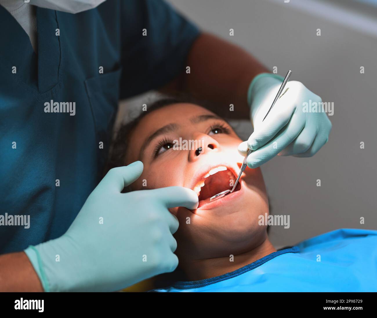 After this you wont have any tooth ache. a young little girl lying down