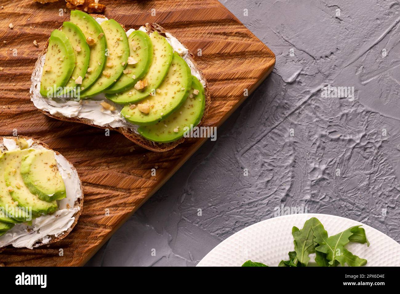 Avocado toasts for breakfast or lunch with rye bread, pumpkin seeds