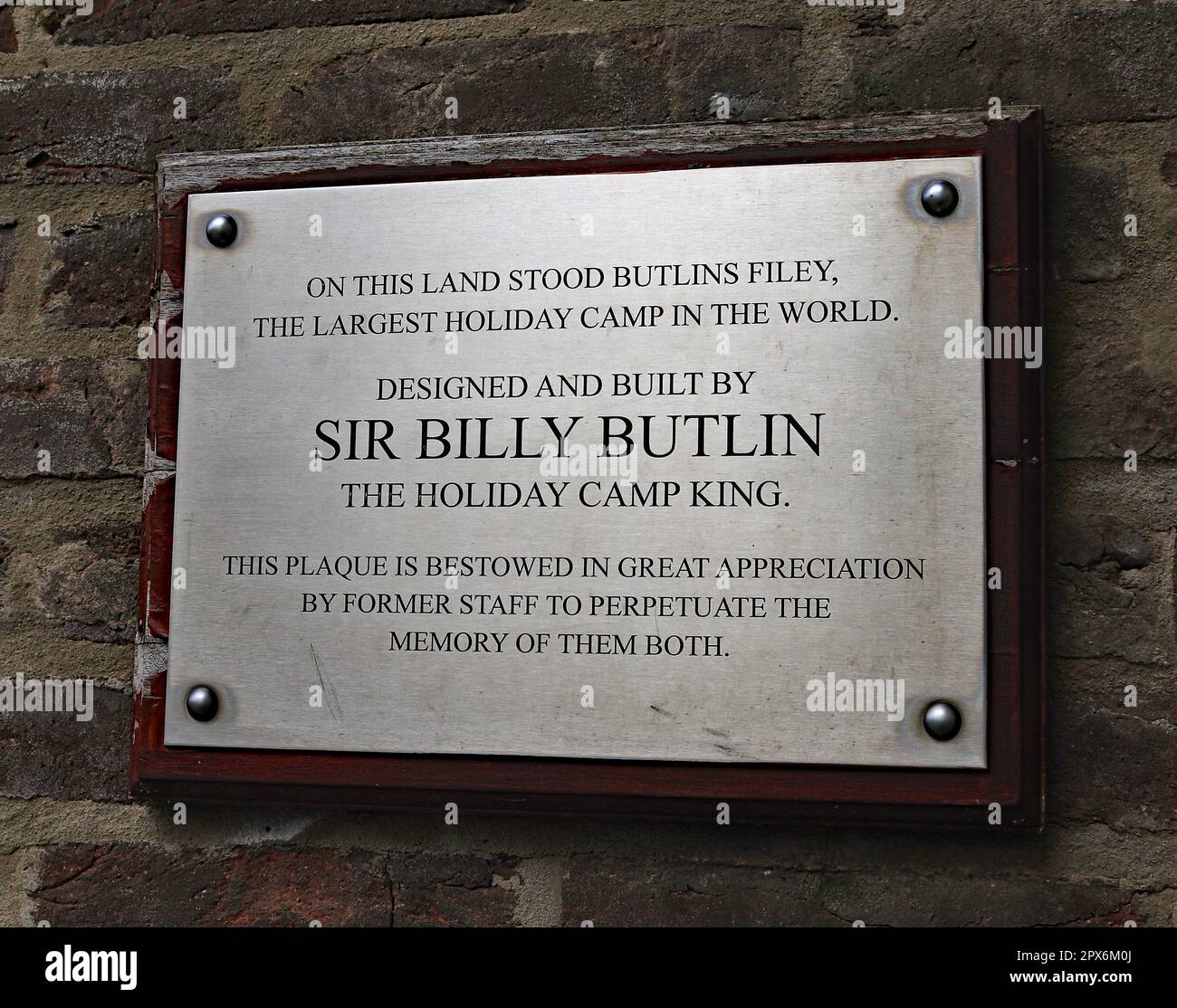 The plaque in the Bay Holiday Park remembering Billy Butlin with this being the site of the first of his holiday parks, near Filey in North Yorkshire. Stock Photo