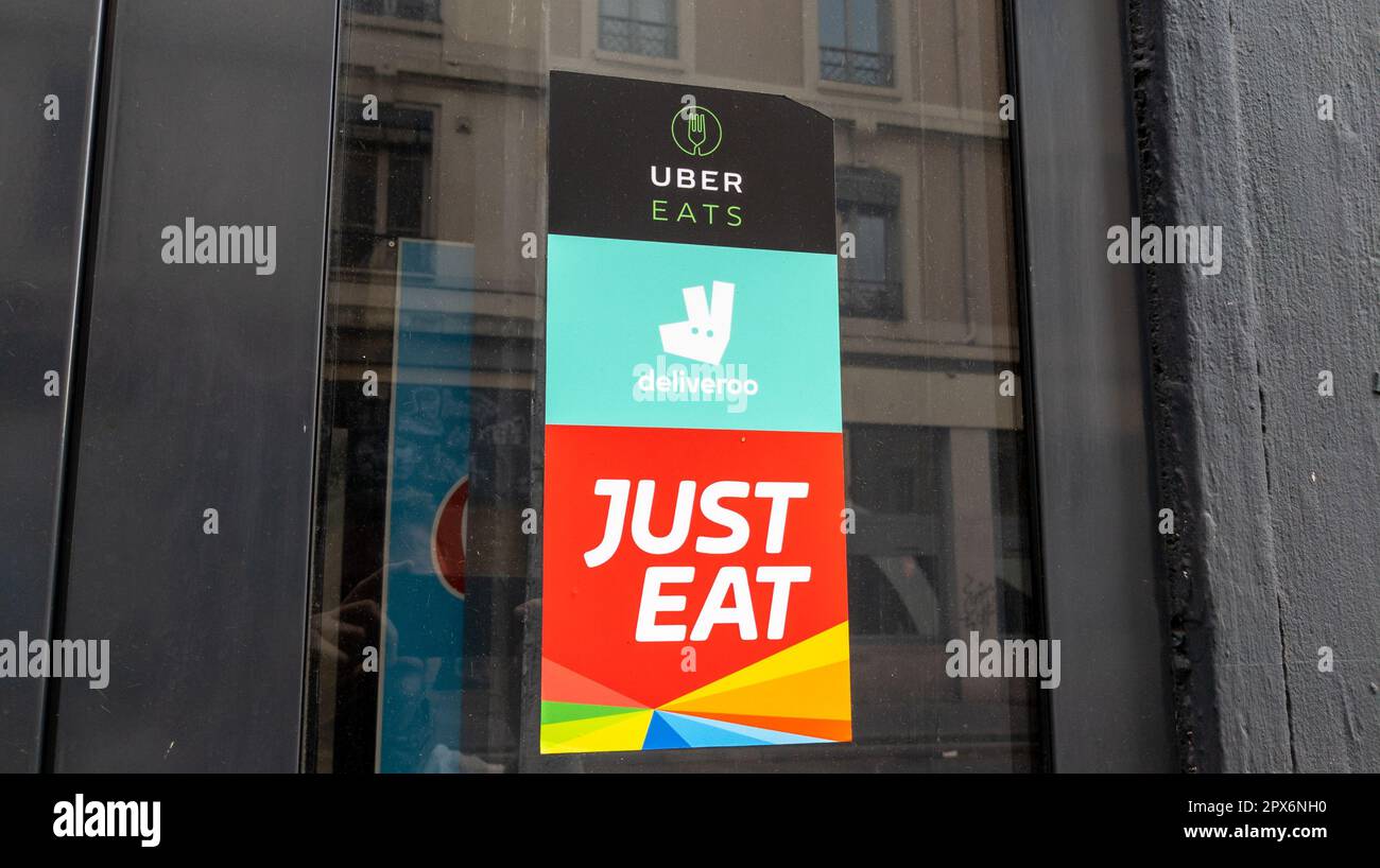 lyon , Aura France 04 20 2023 just eat deliveroo uber eats sign