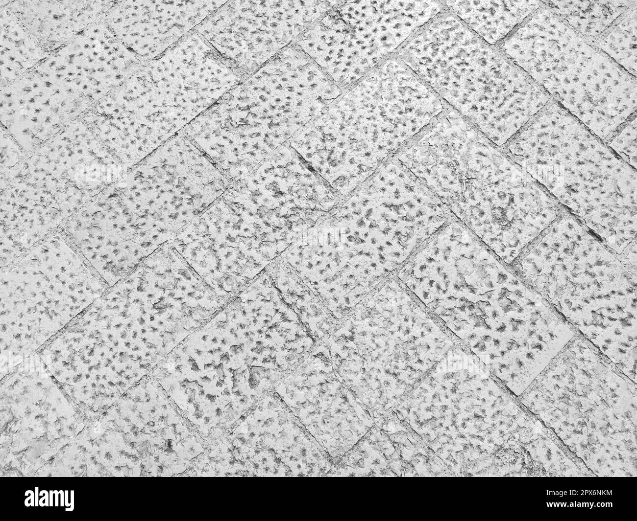 Marble floor on the street, Dubrovnik, Croatia. Antique masonry tiles from rectangular blocks. Black and white photo. Marble is a metamorphic rock com Stock Photo