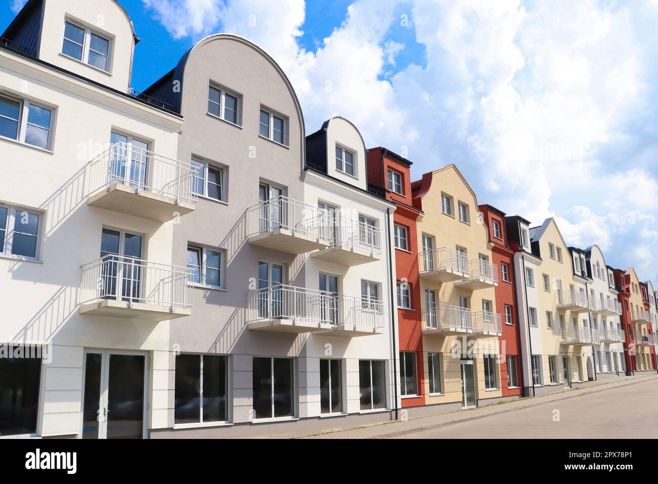 Modern houses with balconies on city street Stock Photo - Alamy