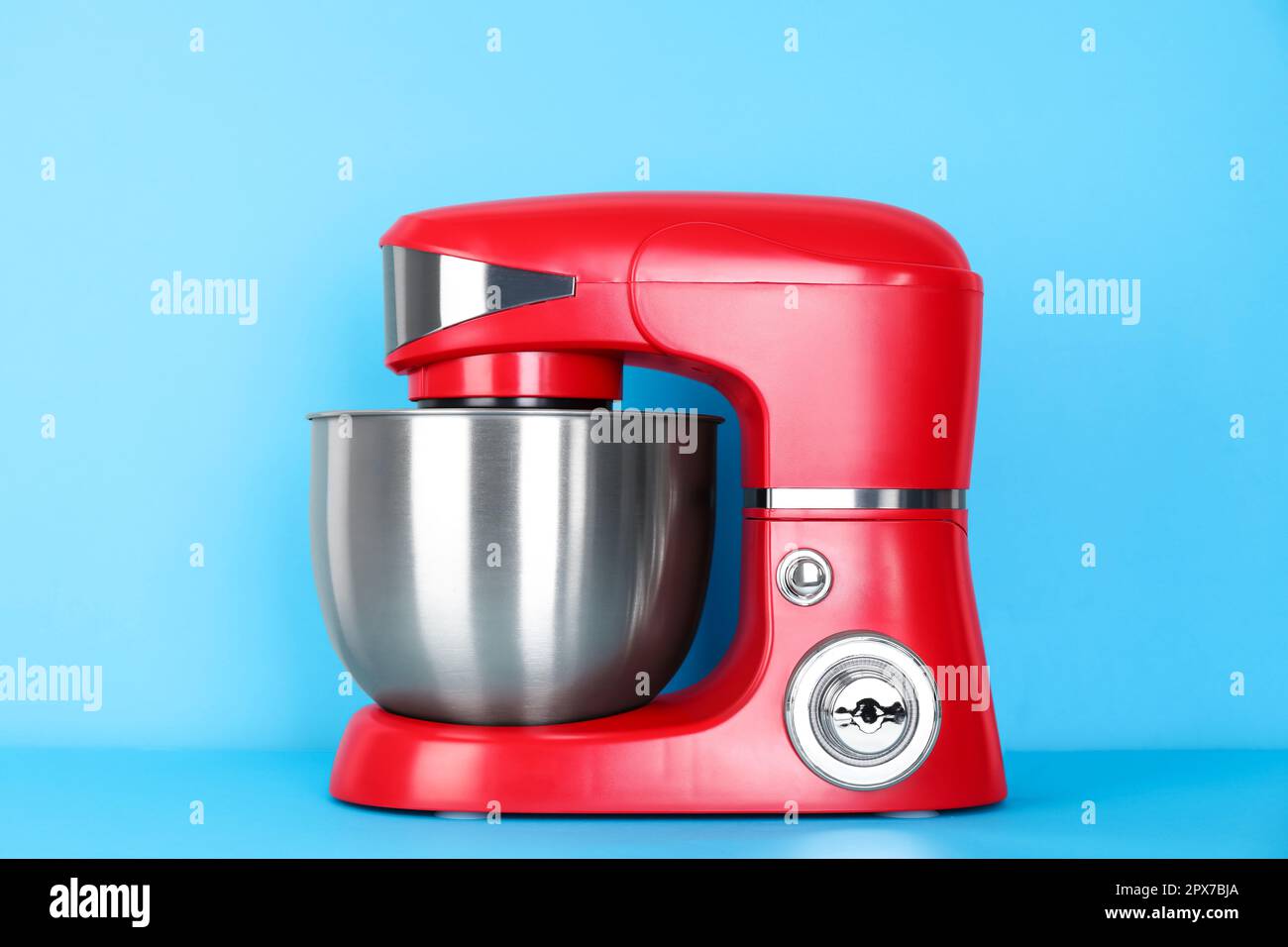 Modern red stand mixer on turquoise background Stock Photo - Alamy