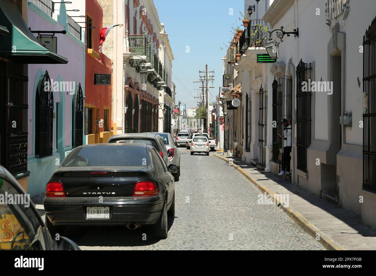 MONTERREY (NUEVO LEON), MEXICO - SEPTEMBER 29, 2022: Beautiful view of city street with parked cars on sunny day Stock Photo