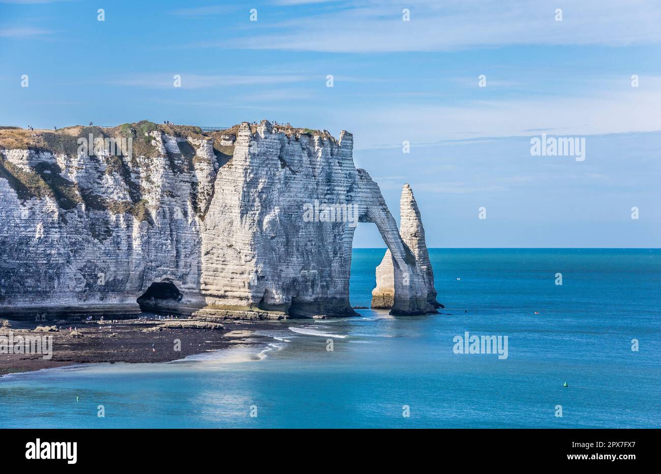 the 70m-high chalk cliff of Falaise d'Aval at Étretat on the Côte d'Albâtre (Alabaster Coast) with  the natural arch of Porte d'Aval and the prominent Stock Photo