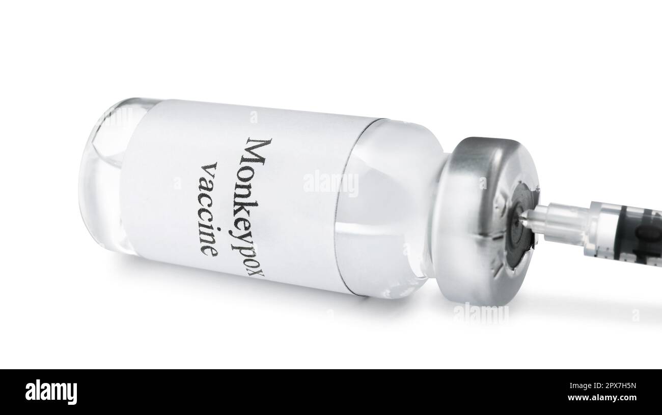 Filling syringe with monkeypox vaccine from vial isolated on white ...