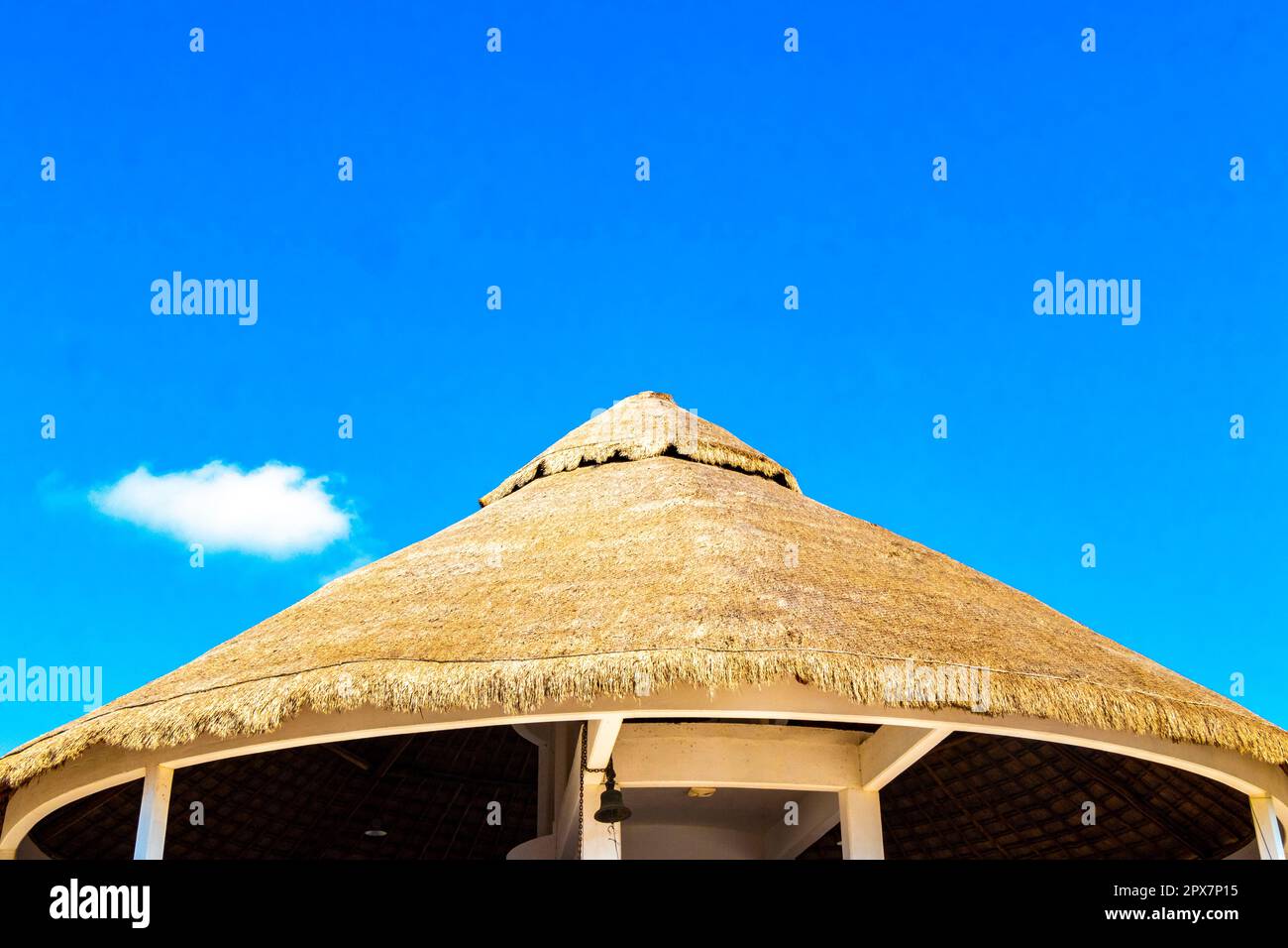 Palapa roof with clear blue sky in paradise in Chiquila Lazaro Cardenas