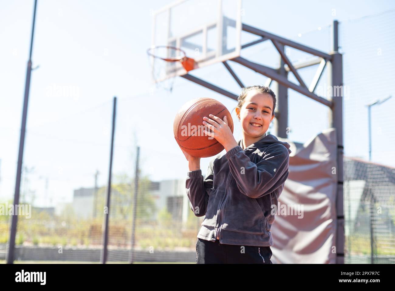 beautiful girl shooting basket and playing basketball Stock Photo Alamy