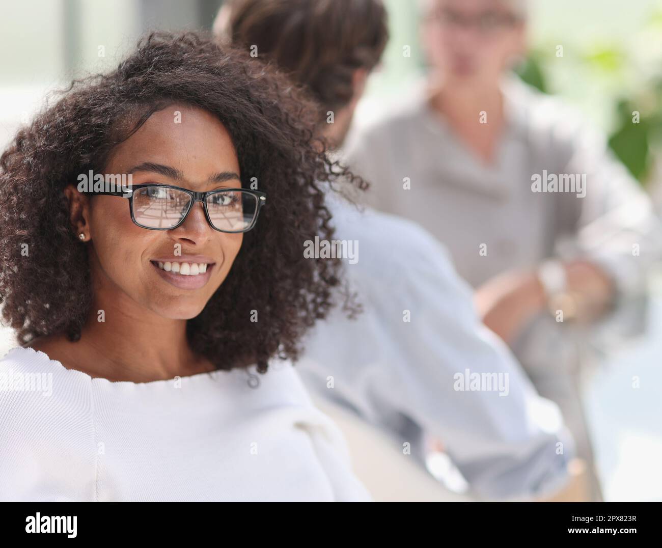 young attractive african american woman in the office Stock Photo - Alamy