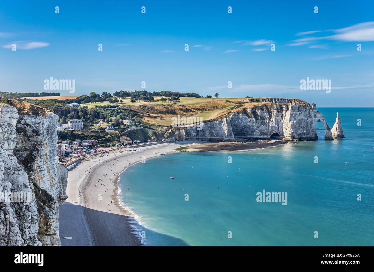 beach of Étretat with view of the 70m-high chalk cliff of Falaise d ...