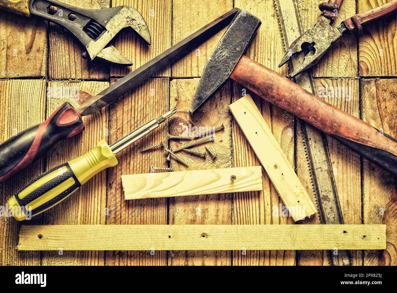Renovation tools in vintage style. Hammer, flat file, pliers