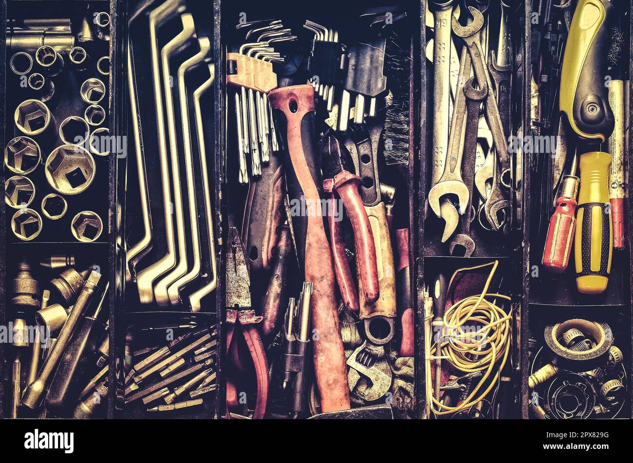 tools in a black metal box. Toolset with interior compartments to keep wrenches, ring