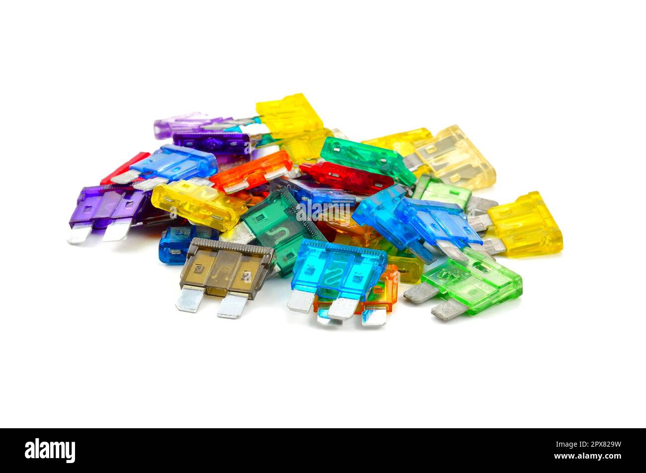 Color car fuse. Pile of colorful electrical automotive fuses or circuit breakers isolated on white background. Stock Photo