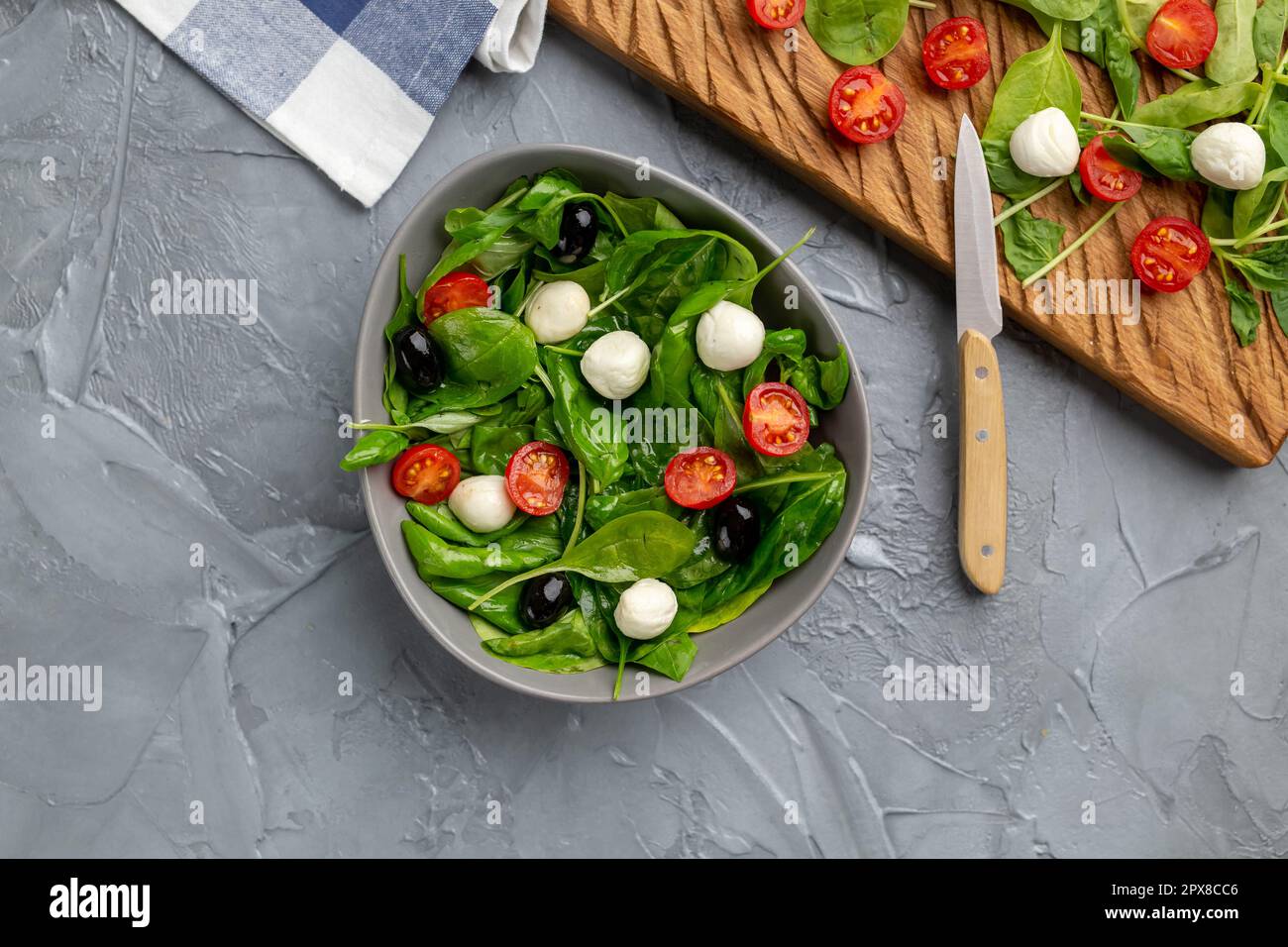 Fresh salad with mozzarella cheese, tomato and spinach. Healthy dieting