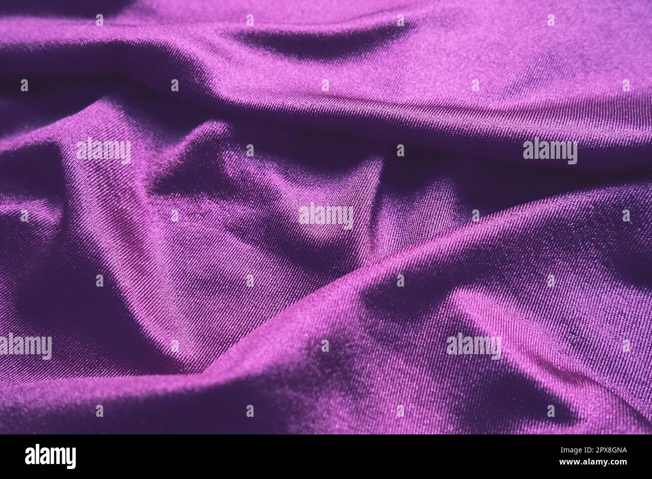 Velour fabric, similar to silk. Textiles in a folds and beautiful waves