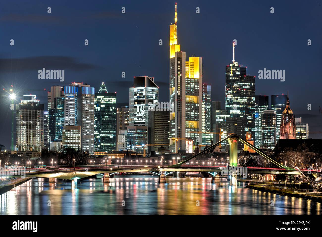 The skyline with the houses and streets of Frankfurt am Main at night ...