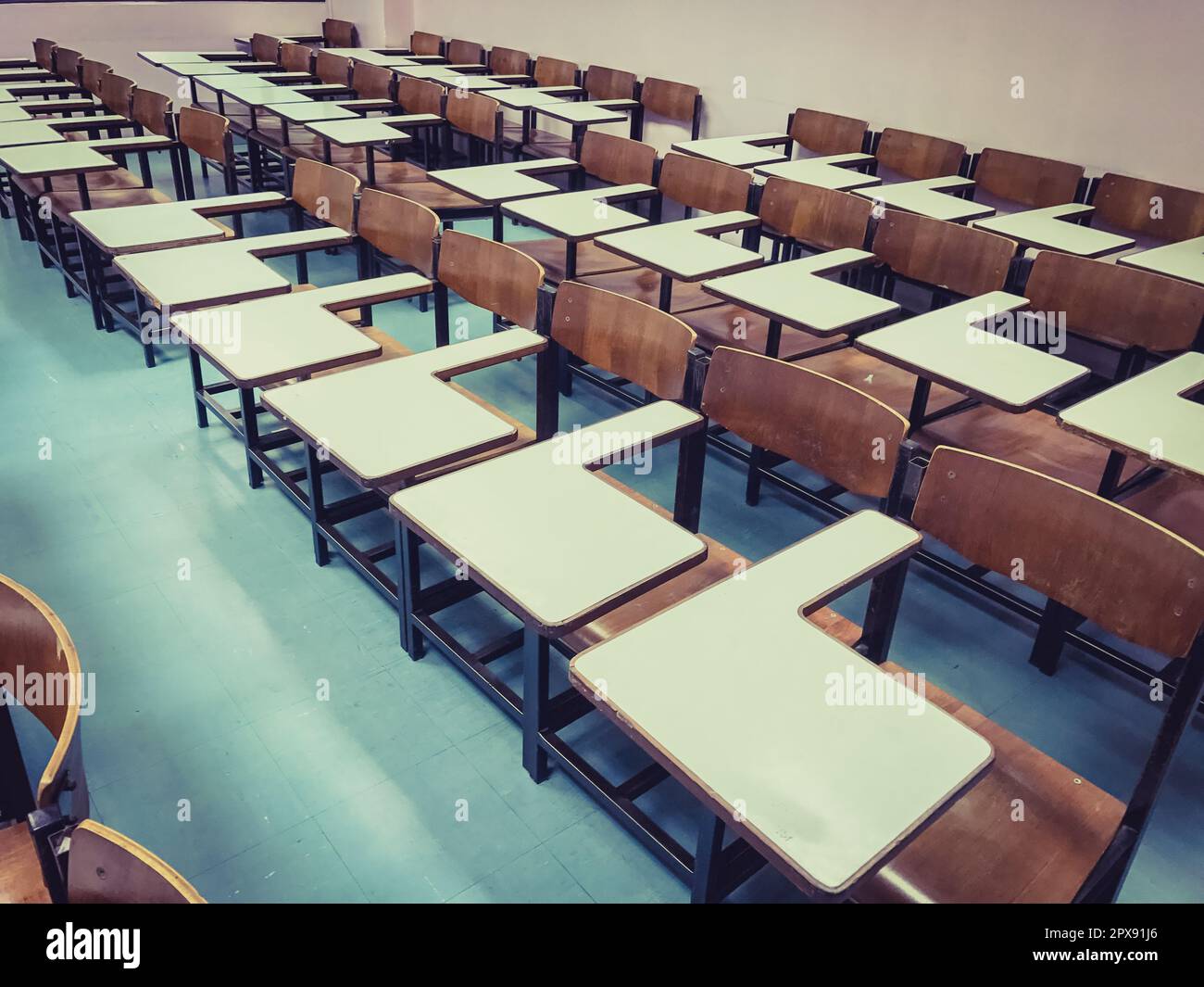 Wooden chairs in the classroom background Stock Photo - Alamy