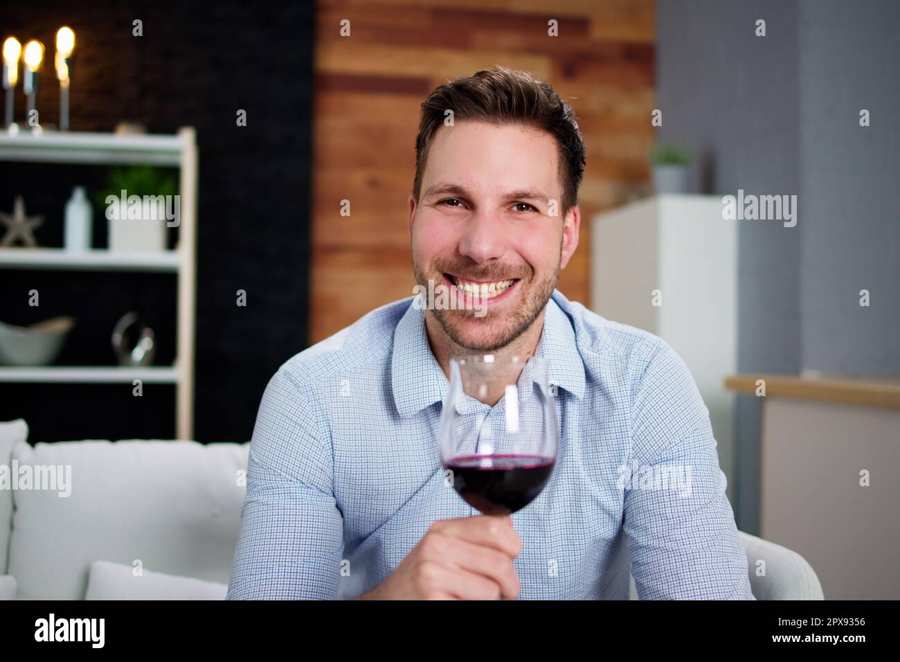 Man Drinking Red Wine In Video Conference At Home Stock Photo - Alamy