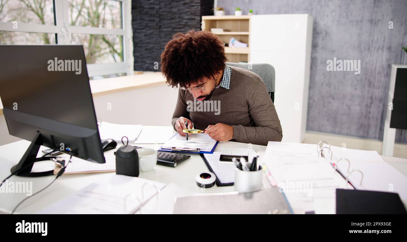 IRS Tax Audit. African Auditor Doing Debt Fraud Inspection Stock Photo ...