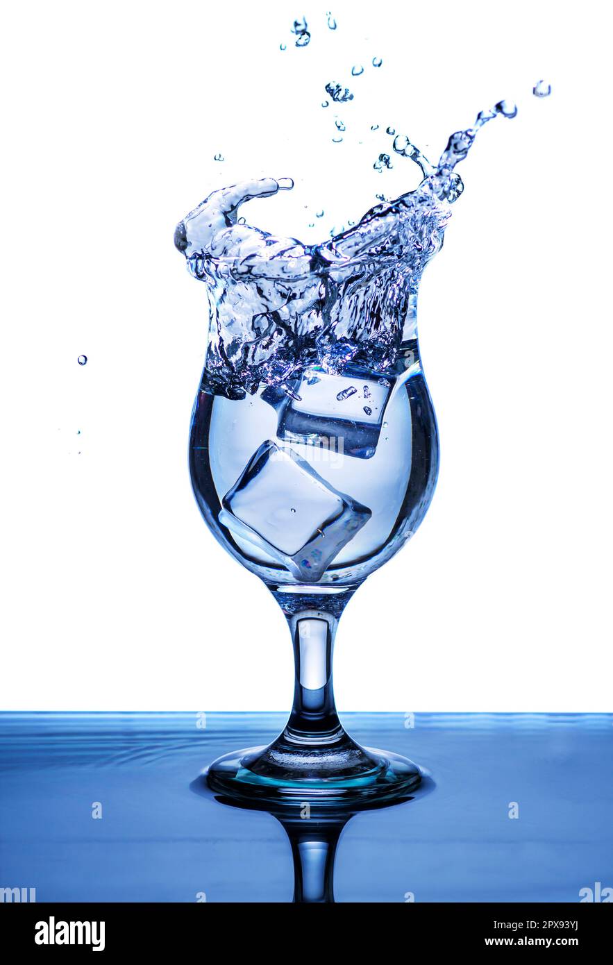 The image of pouring drinking water, into a broken glass, that makes one feel refreshed on blurred white background, Splashing water, Sparkling water Stock Photo